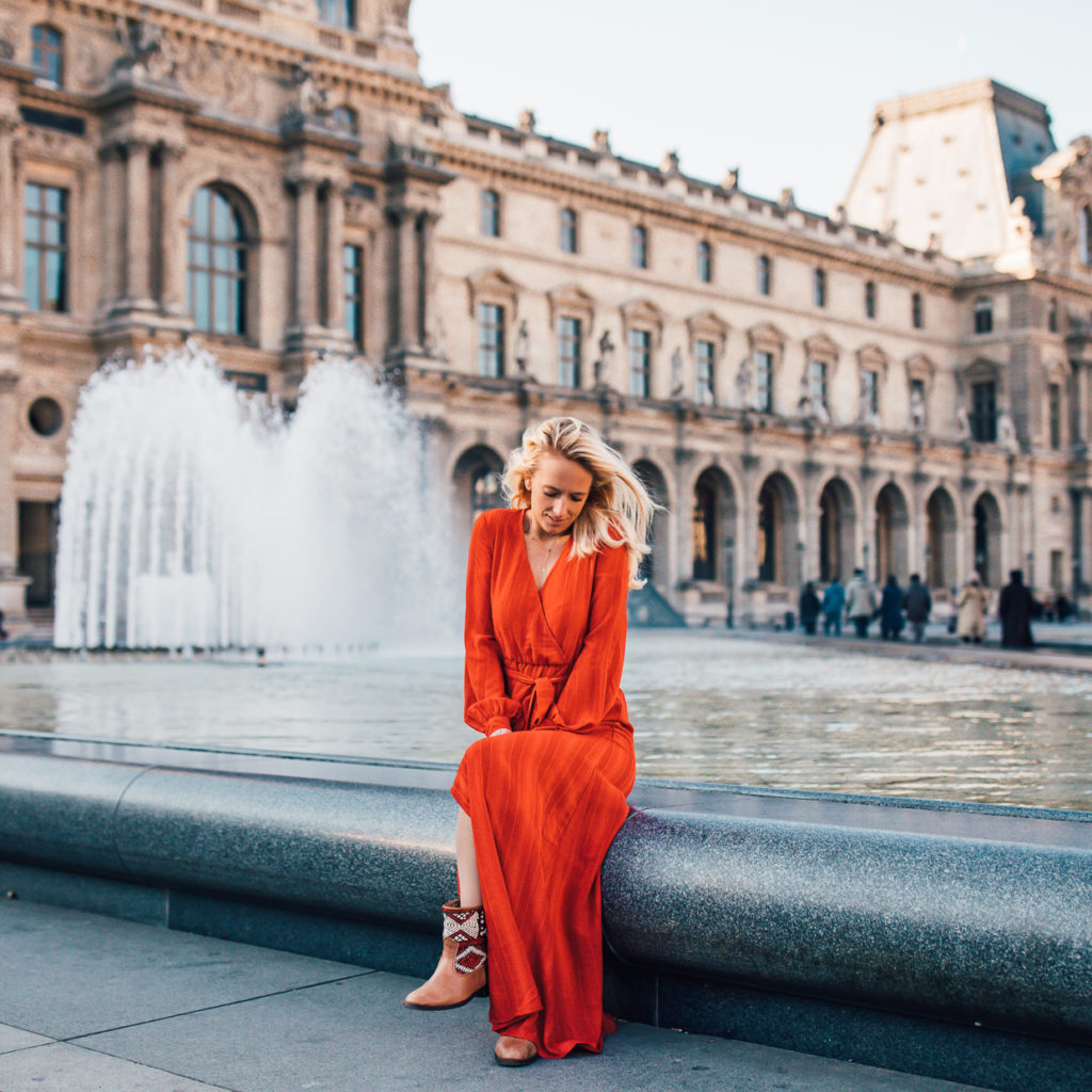 Girl in front of fountain with her kindred spirits leather boots