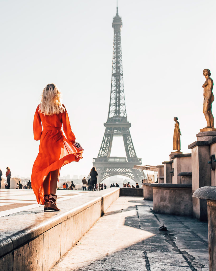 Girl in red dress and vintage kilim rug boots in Paris