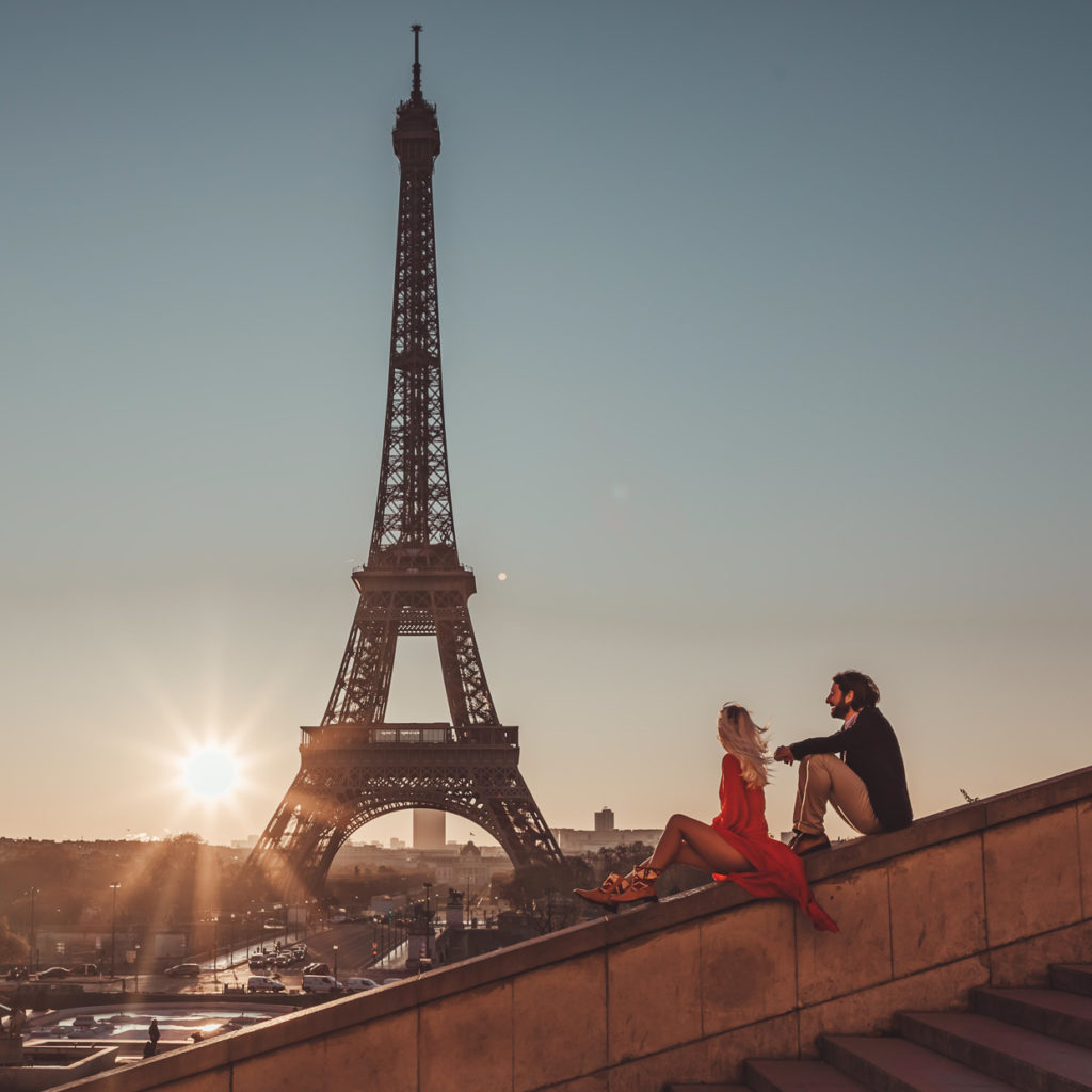 Eiffel Tower and a couple enjoy the views in their leather boots