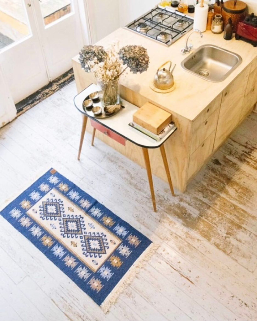 A kitchen with a view featuring our gorgeous kilim rugs